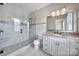 Modern bathroom with a glass-enclosed shower, granite countertops, and stylish vanity at 802 Capington Ln, Waxhaw, NC 28173