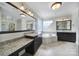 Spacious bathroom with granite countertops, vanity, and large soaking tub at 802 Capington Ln, Waxhaw, NC 28173