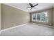 Bright bedroom with large window providing ample natural light and neutral decor at 802 Capington Ln, Waxhaw, NC 28173