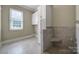 Convenient dog wash station with tiled shower and handheld sprayer, perfect for pet owners at 802 Capington Ln, Waxhaw, NC 28173