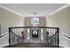 Grand foyer with soaring ceilings, elegant chandelier, and detailed wrought iron staircase at 802 Capington Ln, Waxhaw, NC 28173