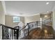 Spacious foyer overlooking a stunning chandelier and staircase with wrought iron details at 802 Capington Ln, Waxhaw, NC 28173