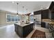 Bright kitchen featuring a large island, stainless steel appliances, and ample counter space at 802 Capington Ln, Waxhaw, NC 28173