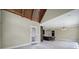 Open kitchen area featuring a large island, dark wood ceiling, and bright lighting at 802 Capington Ln, Waxhaw, NC 28173