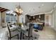 An open-concept kitchen features a large island, modern appliances, and vaulted ceilings at 802 Capington Ln, Waxhaw, NC 28173