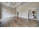 Spacious living room featuring hardwood floors, modern lighting, and bright neutral paint at 802 Capington Ln, Waxhaw, NC 28173