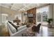 Staged living room showcasing a fireplace, large windows, and comfortable seating at 802 Capington Ln, Waxhaw, NC 28173