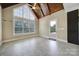 Bright living room featuring vaulted ceilings, large windows, and neutral color palette at 802 Capington Ln, Waxhaw, NC 28173