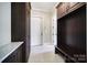 Inviting mudroom with custom built-ins and granite countertops, offering ample storage and organization at 802 Capington Ln, Waxhaw, NC 28173