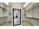 Large walk-in closet with custom shelving and view of bathroom at 802 Capington Ln, Waxhaw, NC 28173