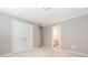 A neutral bedroom with carpet flooring, large closet and view to an en suite bathroom at 8065 Cornhill Ave, Charlotte, NC 28277
