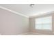 Neutral bedroom with carpet, window with blinds, crown molding, and overhead light fixture at 8065 Cornhill Ave, Charlotte, NC 28277