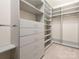 Walk-in closet provides ample shelving and storage space with built-in organizers at 8065 Cornhill Ave, Charlotte, NC 28277