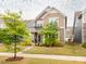 Charming two-story home with a cozy front porch and beautifully landscaped front yard at 8065 Cornhill Ave, Charlotte, NC 28277