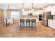 Open kitchen and breakfast nook featuring a center island, stainless appliances, and pendant lighting at 8065 Cornhill Ave, Charlotte, NC 28277