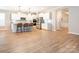 Bright, open kitchen with white cabinetry, stainless steel appliances, and center island with pendant lighting at 8065 Cornhill Ave, Charlotte, NC 28277