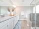 Spa-like main bathroom features a large vanity, framed mirrors, and modern fixtures at 8065 Cornhill Ave, Charlotte, NC 28277