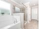 Luxurious main bathroom with separate tub and shower, plus stylish tile at 8065 Cornhill Ave, Charlotte, NC 28277