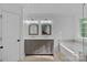 Beautiful bathroom featuring a double vanity, large tub, and contemporary finishes at 8600 Glade Ct, Huntersville, NC 28078