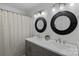 Updated bathroom featuring a double vanity with modern fixtures, and stylish framed mirrors at 8600 Glade Ct, Huntersville, NC 28078