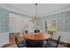 Dining room showcasing a view into the foyer and front yard windows at 8600 Glade Ct, Huntersville, NC 28078