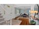 Elegant dining room with hardwood floors, wainscoting, and stylish wallpaper at 8600 Glade Ct, Huntersville, NC 28078