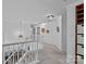Carpeted upstairs hallway with modern lighting and decorative wall hangings at 8600 Glade Ct, Huntersville, NC 28078