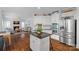 Open-concept kitchen with granite countertops, stainless steel appliances, and seamless access to the living room at 8600 Glade Ct, Huntersville, NC 28078