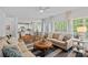 Bright living room with hardwood floors, sofas, and access to other rooms at 8600 Glade Ct, Huntersville, NC 28078