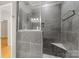 Bathroom shower with glass enclosure, niche, rain shower head, and towel bar at 921 Northeast Dr # 39, Davidson, NC 28036