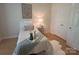 This inviting bedroom showcases a comfortable twin bed with neutral decor and a bright lamp at 921 Northeast Dr # 39, Davidson, NC 28036