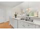 Well-lit kitchen with a breakfast bar overlooking a spacious living area featuring a cozy fireplace at 921 Northeast Dr # 39, Davidson, NC 28036