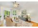 Bright living room with comfortable seating, a ceiling fan, and a view of the balcony at 921 Northeast Dr # 39, Davidson, NC 28036