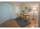 Functional office space with hardwood floors, a modern desk, and ample storage in closets at 921 Northeast Dr # 39, Davidson, NC 28036