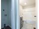 Bathroom featuring a grey vanity with a white countertop and a white tiled shower-tub combination at 1011 Rickert St, Statesville, NC 28677