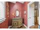 Elegant powder room with beautiful vanity and ornate mirror at 110 Devonshire Ln, Salisbury, NC 28146