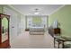 Comfortable bedroom with natural light, ample closet space, and green walls at 110 Devonshire Ln, Salisbury, NC 28146