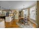 Charming breakfast nook with lots of sunlight, hardwood floors, and a view of the kitchen at 110 Devonshire Ln, Salisbury, NC 28146