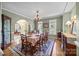 Elegant dining room with vintage furniture, hardwood floors, and abundant natural light at 110 Devonshire Ln, Salisbury, NC 28146