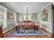 Formal dining room featuring a classic chandelier and seating for eight guests at 110 Devonshire Ln, Salisbury, NC 28146