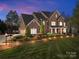Stunning two-story brick home with a landscaped front yard and a three-car garage at 110 Devonshire Ln, Salisbury, NC 28146