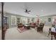 Spacious living room featuring neutral tones, plush seating, and abundant natural light from large windows at 110 Devonshire Ln, Salisbury, NC 28146