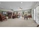 Bright living room with display cabinet, comfortable seating, and a table, perfect for entertaining at 110 Devonshire Ln, Salisbury, NC 28146