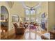 Bright living room boasts high ceilings, large windows, fireplace, and hardwood floors at 110 Devonshire Ln, Salisbury, NC 28146