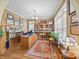 Cozy home office featuring custom bookshelves, a large desk, and natural light at 110 Devonshire Ln, Salisbury, NC 28146