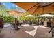 Outdoor patio featuring patio furniture with umbrellas and views of lush backyard greenery at 110 Devonshire Ln, Salisbury, NC 28146
