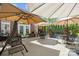 Outdoor patio featuring patio furniture with umbrellas and views of lush backyard greenery at 110 Devonshire Ln, Salisbury, NC 28146