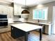 Modern kitchen with stainless steel appliances, white countertops and center island at 117 Blackbeard Ln, Mooresville, NC 28117
