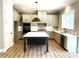 Stylish kitchen with modern appliances, ample counter space, and a large center island at 117 Blackbeard Ln, Mooresville, NC 28117