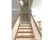 Bright staircase with wood and white accents leading to the second floor at 117 Blackbeard Ln, Mooresville, NC 28117